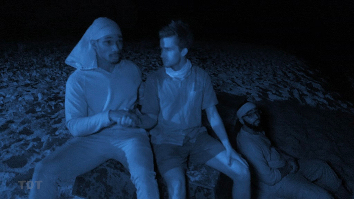 Q, Charlie shake hands