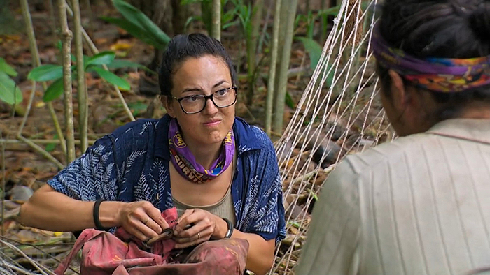 Rachel repairing Teeny's bag?